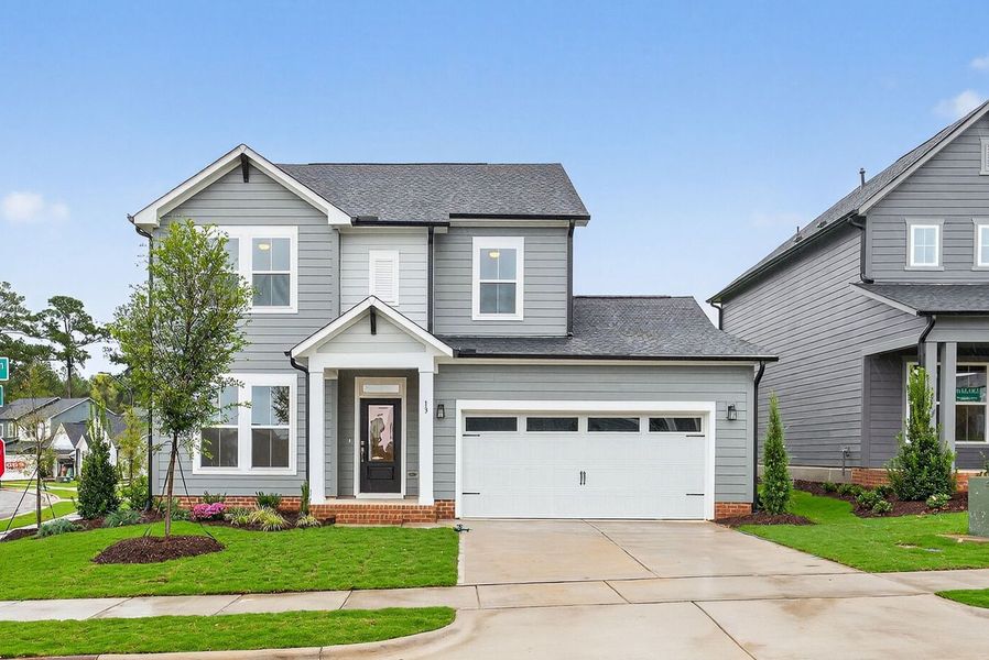 Representative exterior photo of a completed home built from the The Redbud by David Weekley Homes in Serenity - The Village Collection, Fuquay Varina, NC (Image 1).