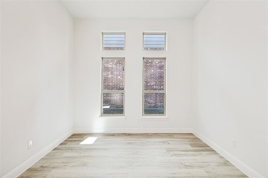 Spare room with light hardwood / wood-style floors