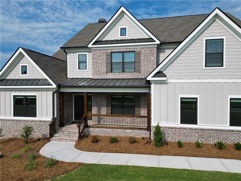 Front exterior of a new home in Stonegate, Monroe, GA, highlighting curb appeal (Image 24).
