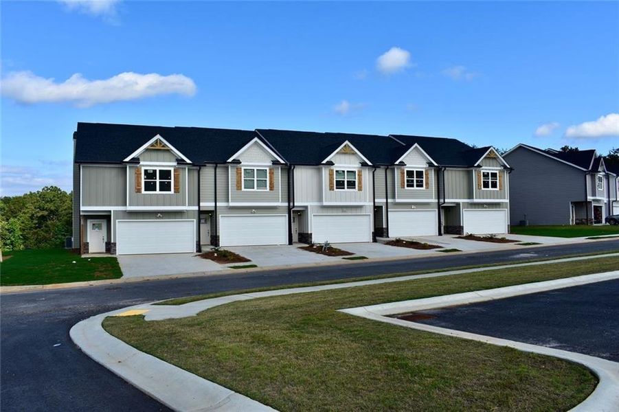 Front exterior of a new home in , Lula, GA, highlighting curb appeal (Image 15).