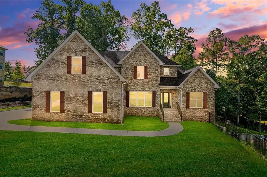 Front exterior of a new home in , South Fulton, GA, highlighting curb appeal (Image 2). Front exterior of a new home in , South Fulton, GA, highlighting curb appeal (Image 2).