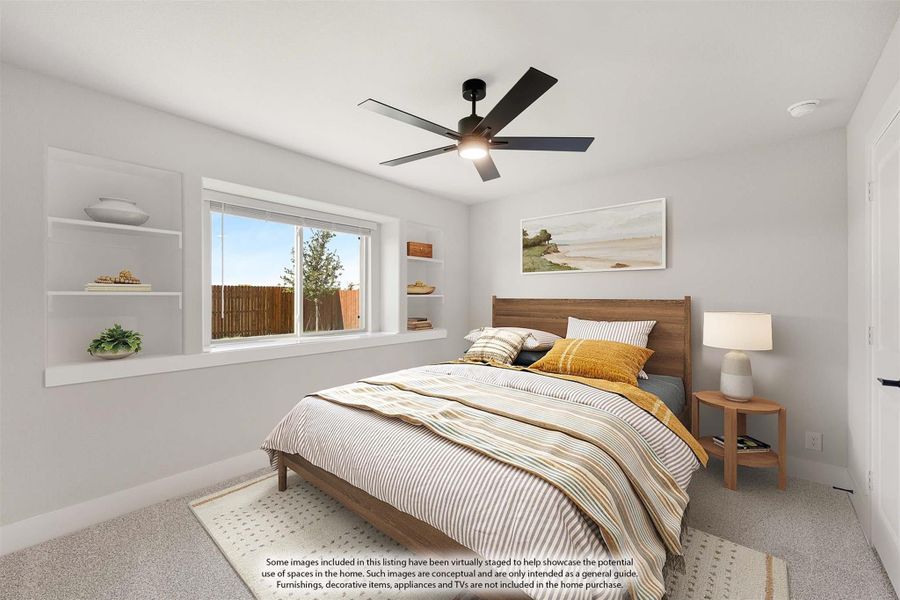 Bedroom with wood-frame bed, built-in wall shelves, ceiling fan, and large window with backyard view