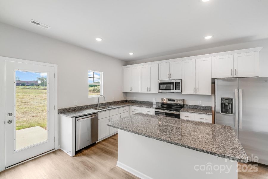 Furnished interior view inside a new home in , Statesville (Image 9).