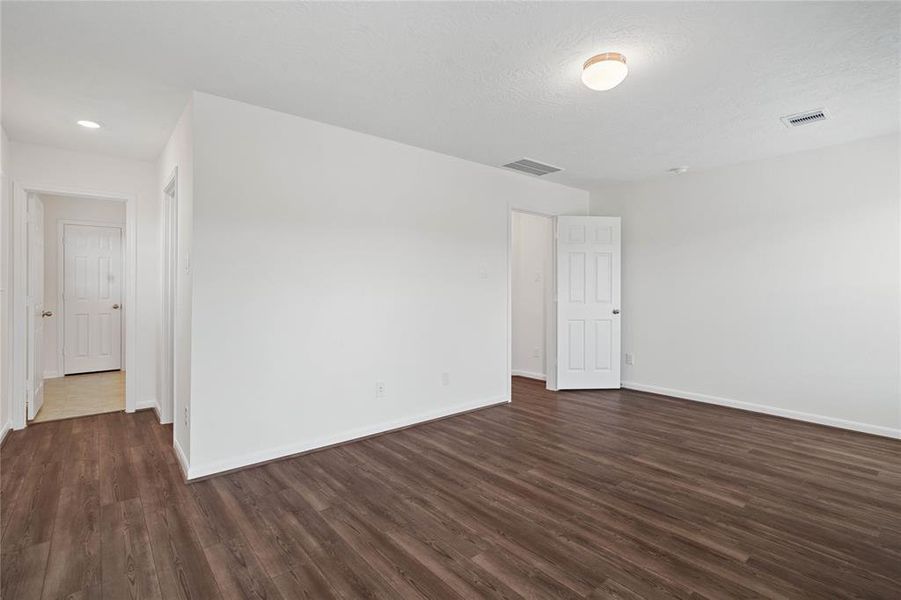 Another view of this beautiful and spacious primary bedroom.