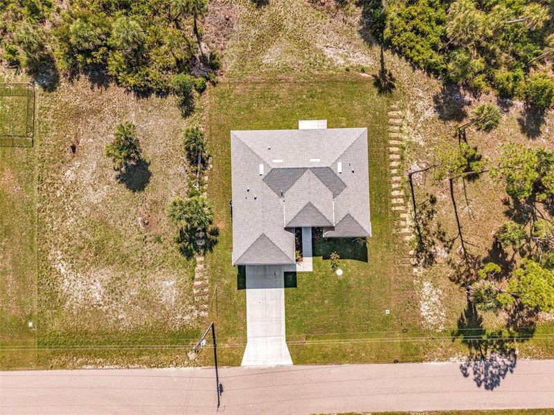 Front exterior of a new home in , Placida, FL, highlighting curb appeal (Image 27).