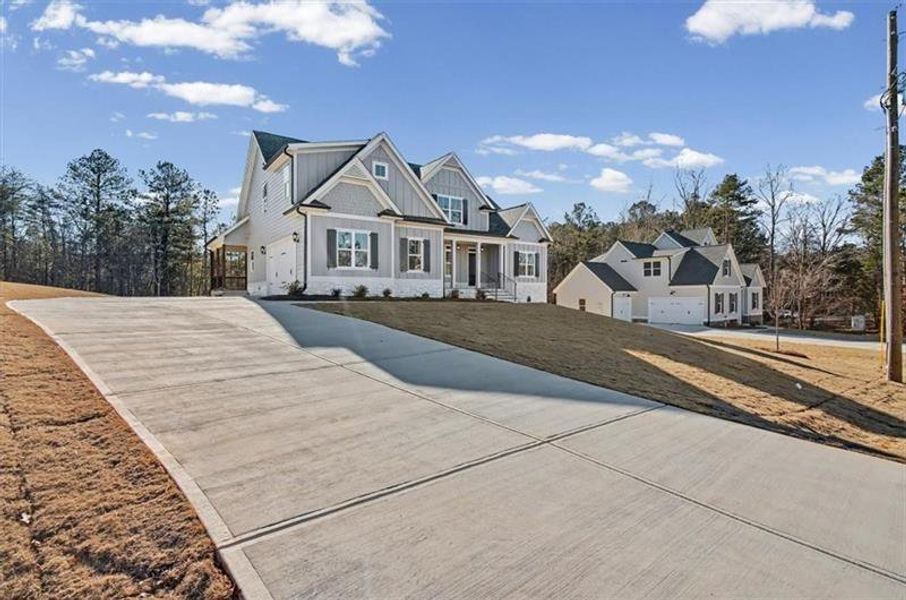 Front exterior of a new home in , Waleska, GA, highlighting curb appeal (Image 22).