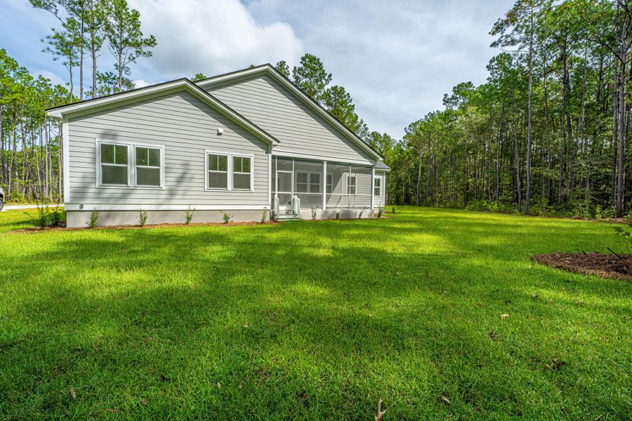 Exterior details and patio area of a home in , Awendaw (Image 27).