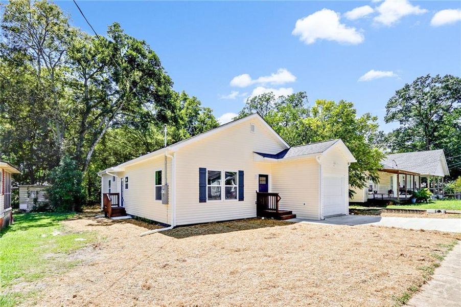 Front exterior of a new home in , Cedartown, GA, highlighting curb appeal (Image 14).