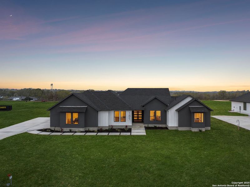 Front exterior of a new home in , Floresville, TX, highlighting curb appeal (Image 25). Front exterior of a new home in , Floresville, TX, highlighting curb appeal (Image 25).