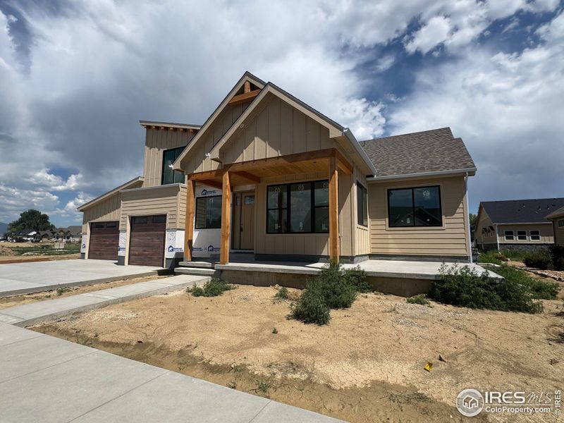 Front exterior of a new home in , Berthoud, CO, highlighting curb appeal (Image 2). Front exterior of a new home in , Berthoud, CO, highlighting curb appeal (Image 2).