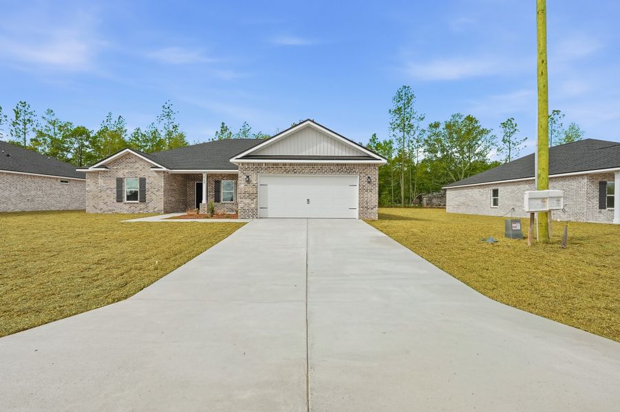 Front exterior of a new home in Southern Charm, Crestview, FL, highlighting curb appeal (Image 26).