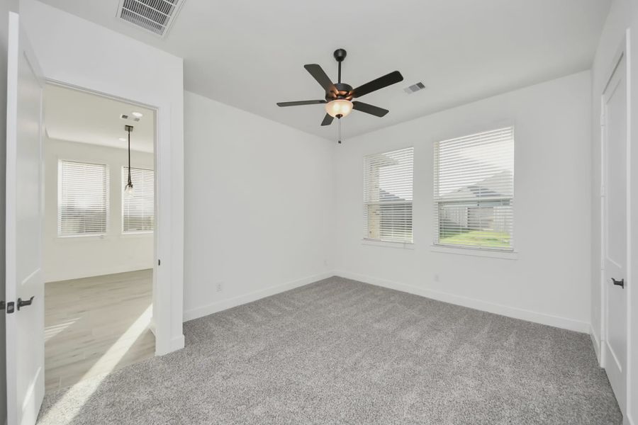 Representative unfurnished interior of a home built from the Bonneville by Chesmar Homes in Meridiana 50's and 60's, Manvel (Image 35).