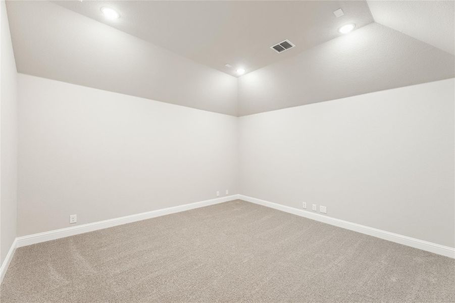Empty room with beige carpet, white walls, recessed lighting, and white baseboards Empty room with beige carpet, white walls, recessed lighting, and white baseboards