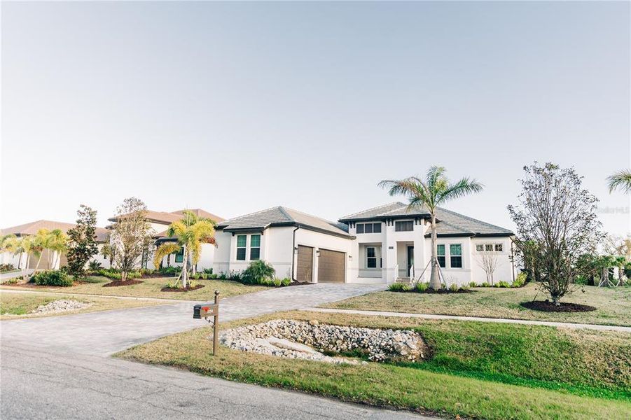 Front exterior of a new home in , Nokomis, FL, highlighting curb appeal (Image 26).