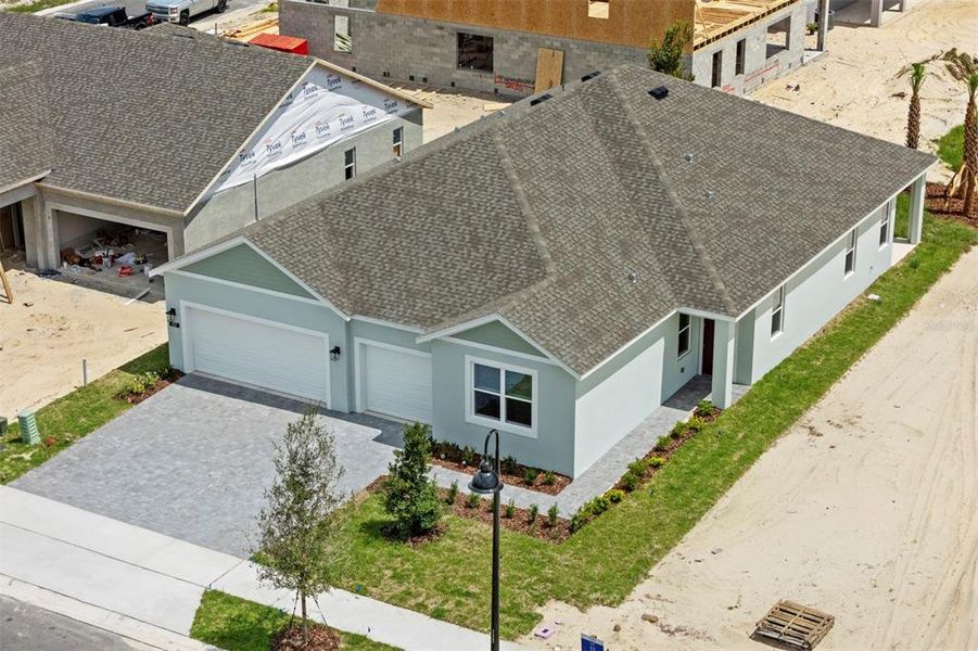Front exterior of a new home in Trinity Gardens, Deland, FL, highlighting curb appeal (Image 17). Front exterior of a new home in Trinity Gardens, Deland, FL, highlighting curb appeal (Image 17).