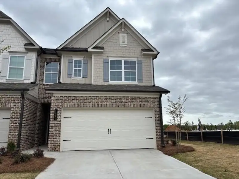 Front exterior of a new home in , Suwanee, GA, highlighting curb appeal (Image 1). Front exterior of a new home in , Suwanee, GA, highlighting curb appeal (Image 1).