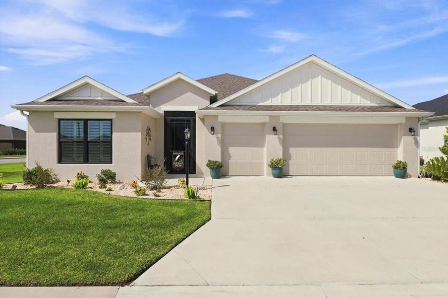 Front exterior of a new home in , The Villages, FL, highlighting curb appeal (Image 22).