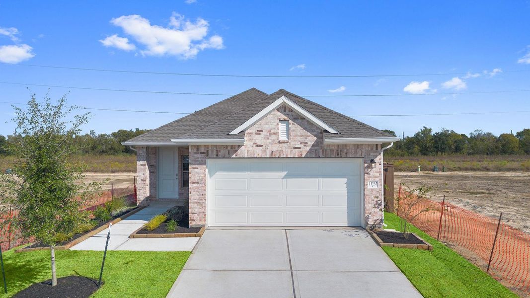 Front exterior of a new home in Creekhaven, Rosharon, TX, highlighting curb appeal (Image 15).