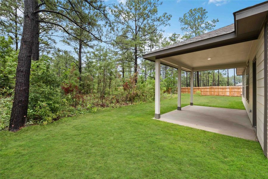 Front exterior of a new home in Deer Pines, Conroe, TX, highlighting curb appeal (Image 18).