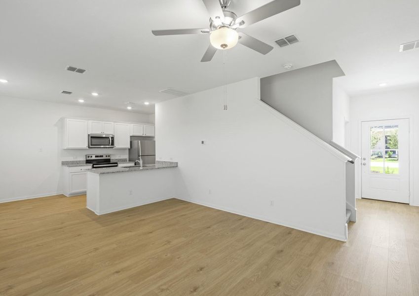 Vinyl flooring flows throughout the first floor