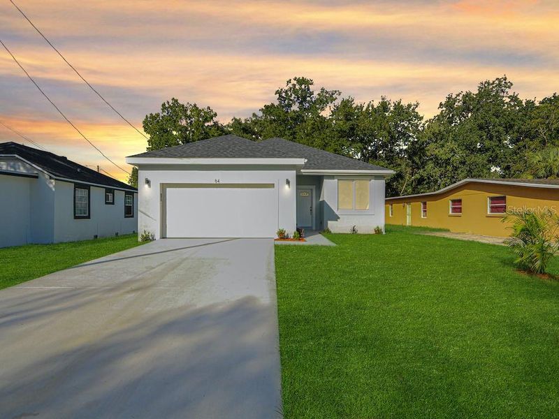 Front exterior of a new home in , Orlando, FL, highlighting curb appeal (Image 14). Front exterior of a new home in , Orlando, FL, highlighting curb appeal (Image 14).