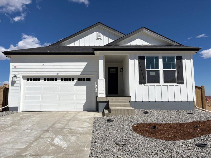 Front exterior of a new home in , Erie, CO, highlighting curb appeal (Image 1). Front exterior of a new home in , Erie, CO, highlighting curb appeal (Image 1).