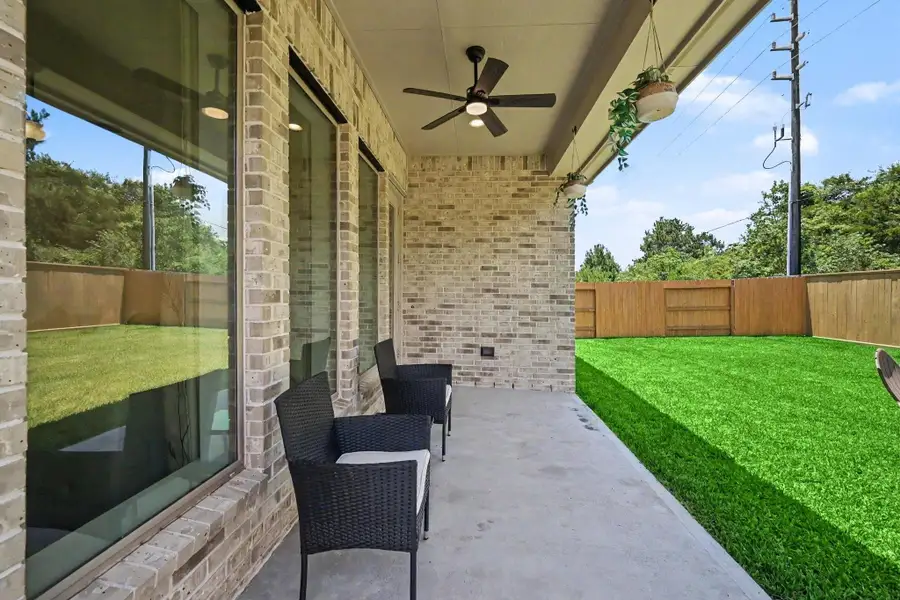 Step outside to the peaceful covered patio overlooking the backyard. Step outside to the peaceful covered patio overlooking the backyard.