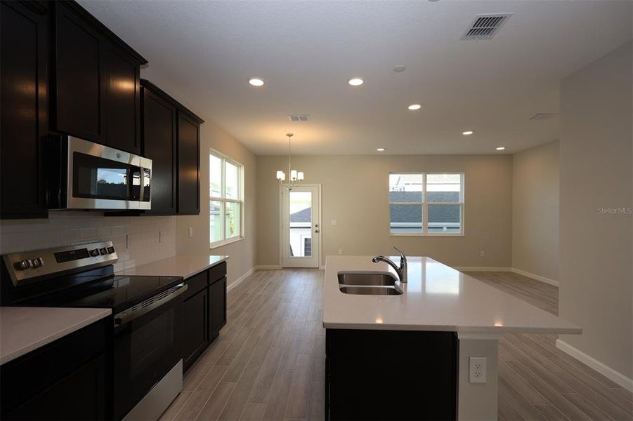 Furnished interior view inside a new home in Tribute at Ovation, Winter Garden (Image 11).