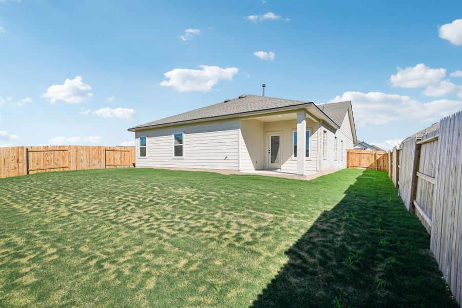 Exterior details and patio area of a home in Village at Three Oaks, Seguin (Image 4).