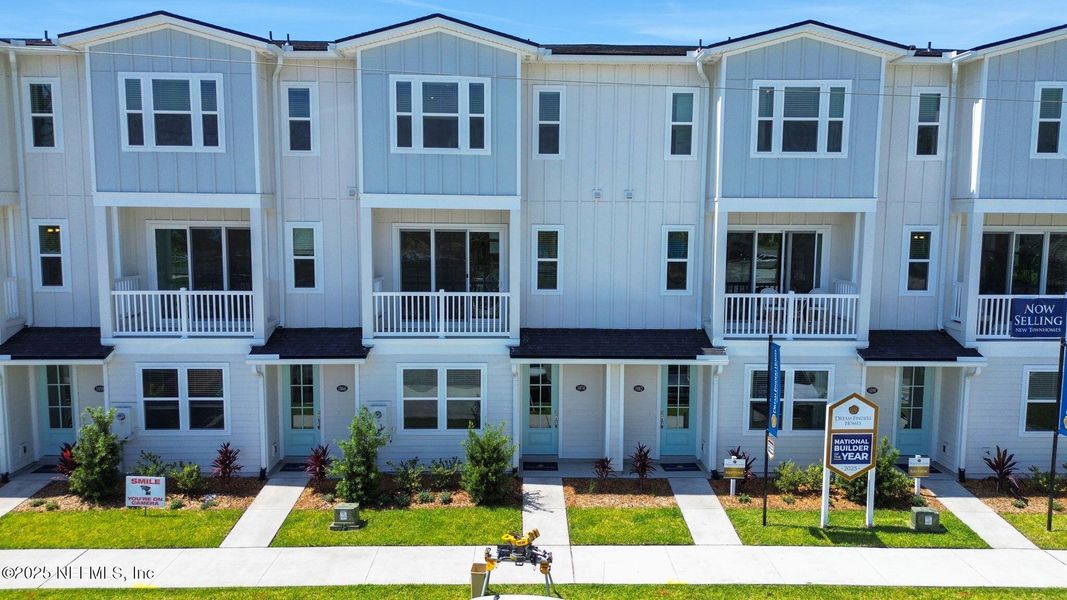 Front exterior of a new home in North Beach Townhomes, Jacksonville Beach, FL, highlighting curb appeal (Image 17).