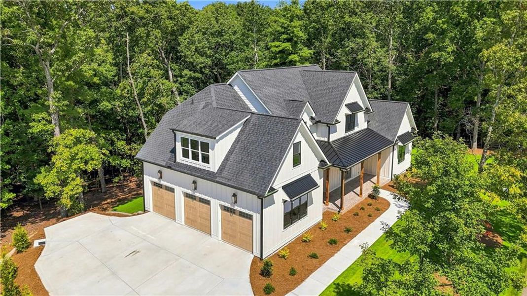 Front exterior of a new home in , Flowery Branch, GA, highlighting curb appeal (Image 26). Front exterior of a new home in , Flowery Branch, GA, highlighting curb appeal (Image 26).