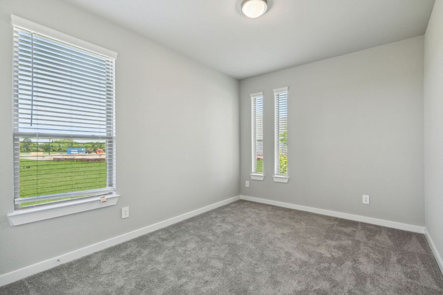 Bedroom in the Henley home plan by Trophy Signature Homes – REPRESENTATIVE PHOTO