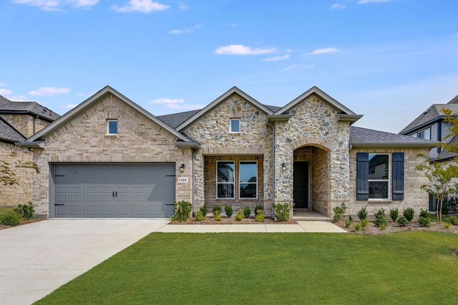 Front exterior of a new home in The Ridge at Northlake 60s, Northlake, TX, highlighting curb appeal (Image 1).