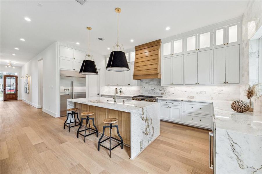 Cabinets to the ceiling with glass uppers