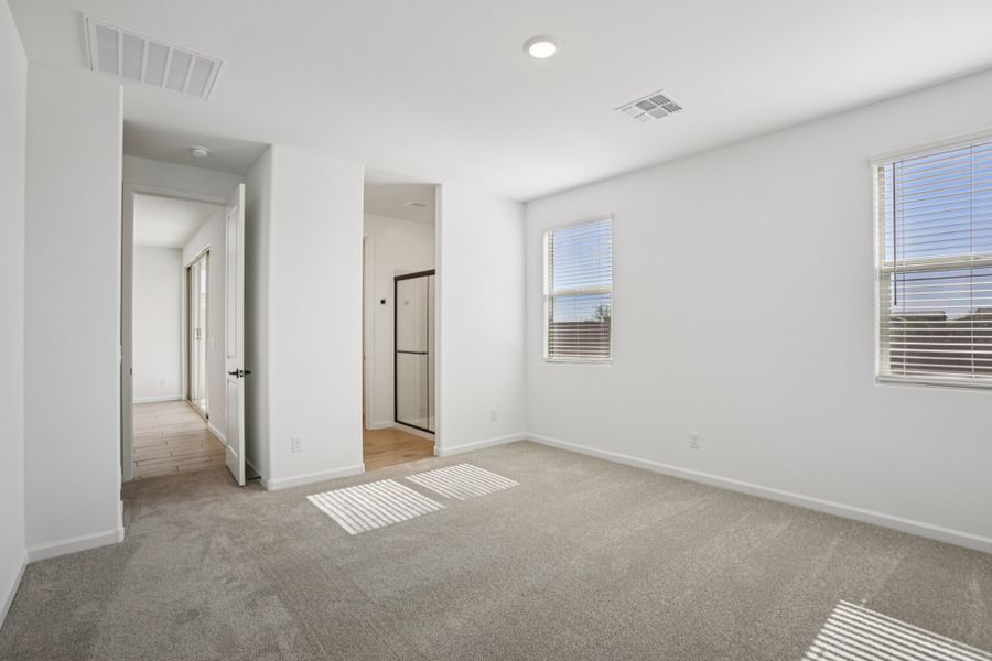 Primary suite. Finishes and options may vary by community.