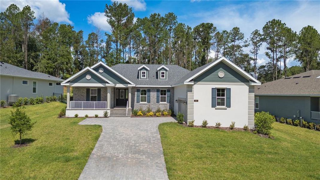 Front exterior of a new home in Southern Hills Plantation, Brooksville, FL, highlighting curb appeal (Image 2). Front exterior of a new home in Southern Hills Plantation, Brooksville, FL, highlighting curb appeal (Image 2).