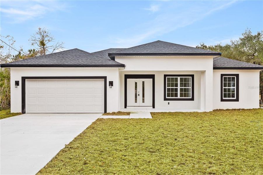 Front exterior of a new home in , Citrus Springs, FL, highlighting curb appeal (Image 23).
