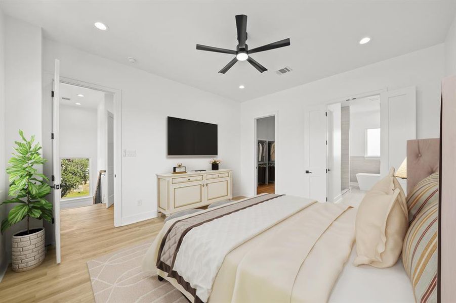 Virtually Staged: Spacious primary bedroom located on the third floor, featuring recessed lighting, a ceiling fan, and luxury vinyl plank floors. Photos are from a similar unit in the development.