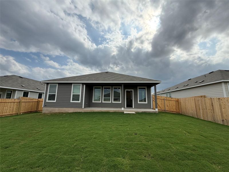 Front exterior of a new home in Bertram Oaks: Classic Collection, Bertram, TX, highlighting curb appeal (Image 15). Front exterior of a new home in Bertram Oaks: Classic Collection, Bertram, TX, highlighting curb appeal (Image 15).