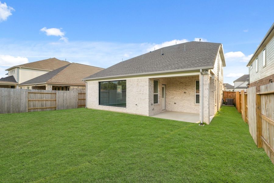 Exterior details and patio area of a home in Sunterra, Katy (Image 15).