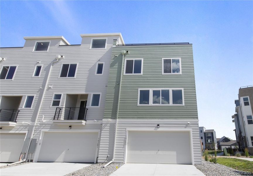 Front exterior of a new home in Dillon Pointe - Skyview, Broomfield, CO, highlighting curb appeal (Image 2).