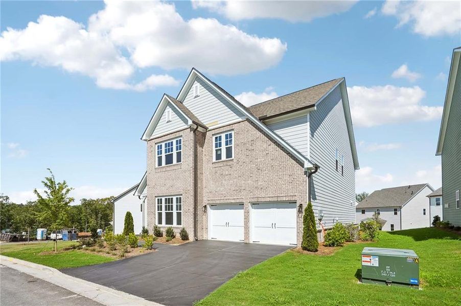 Front exterior of a new home in East Harbor II at Chestatee, Dawsonville, GA, highlighting curb appeal (Image 18).