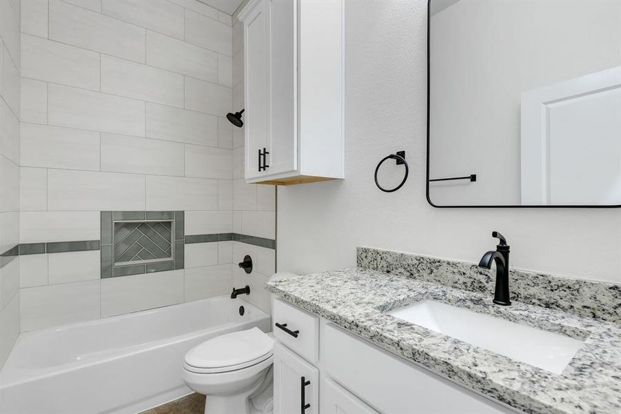 Full bathroom featuring vanity and bathtub / shower combination