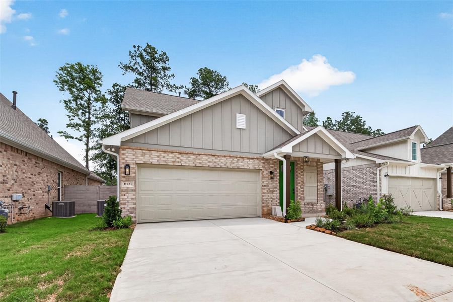 Front exterior of a new home in Two Step Farm, Montgomery, TX, highlighting curb appeal (Image 23).
