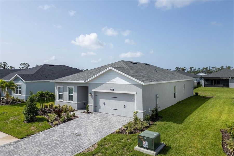 Front exterior of a new home in , Port Charlotte, FL, highlighting curb appeal (Image 1). Front exterior of a new home in , Port Charlotte, FL, highlighting curb appeal (Image 1).