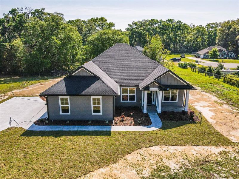 Front exterior of a new home in , O'Brien, FL, highlighting curb appeal (Image 2). Front exterior of a new home in , O'Brien, FL, highlighting curb appeal (Image 2).
