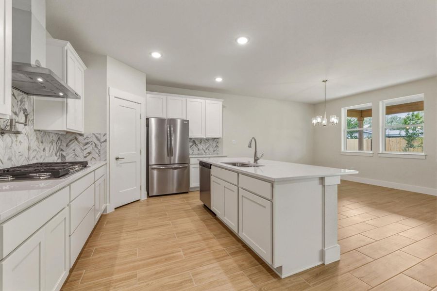 Large kitchen island to separate from dining room.  Dishwasher and Fridge.