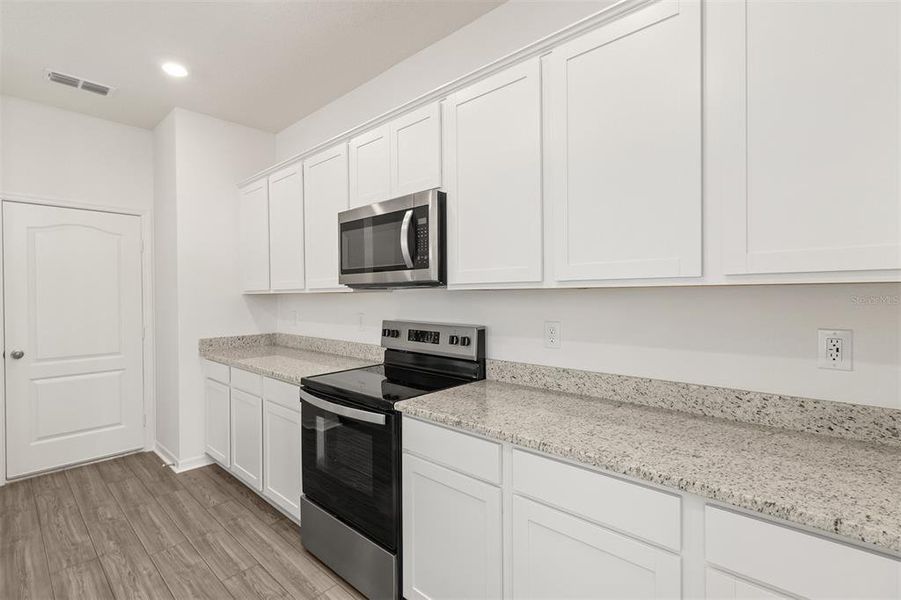 Furnished interior view inside a new home in Peach Crossings, Winter Haven (Image 5).