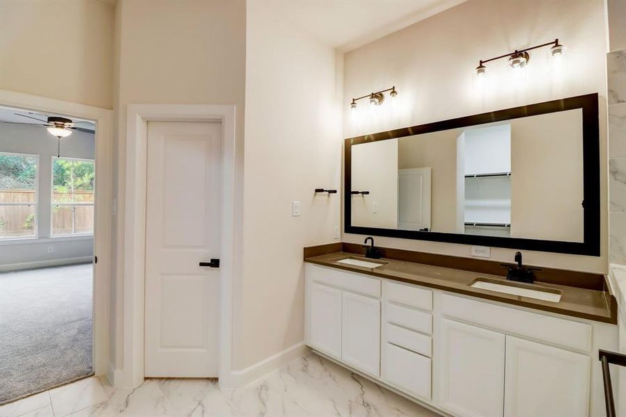 EXAMPLE PHOTO: Large vanity area with dual sinks and quartz counters