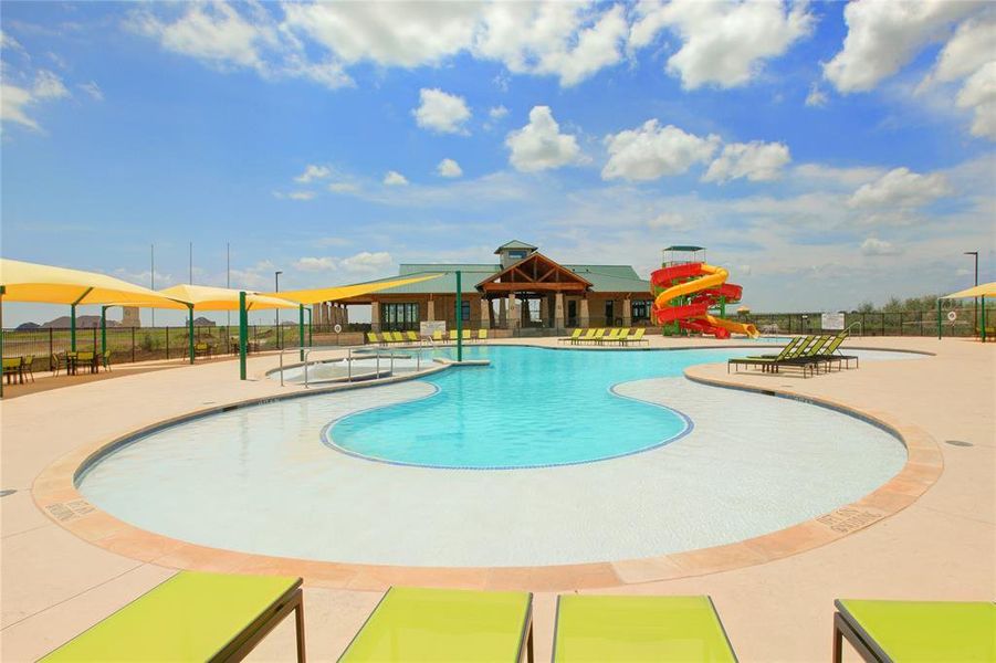 View of swimming pool featuring a patio and a water slide